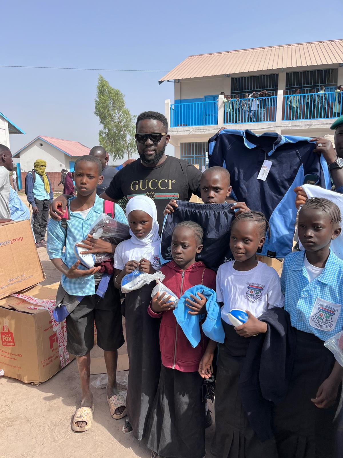 Sergeant Maxi helps School children in the Gambia